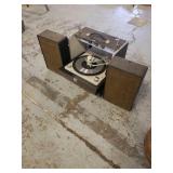 Portable turntable with attached speakers