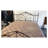 King size bed. Metal frame with bedding