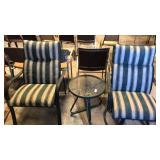 2 patio chairs with round glass table