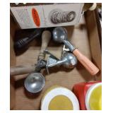 Flat with vintage ice cream scoops, thermos, and
