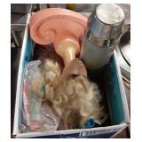 Box with thermos, doll, and more