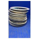 Stack of assorted collectors plates