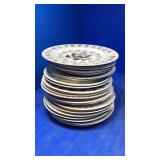 Stack of assorted collectors plates