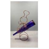 Wire chef with cobalt bottle