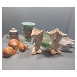 Bread tray with glass vases, snails, and more