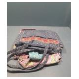 Stack of Vera Bradley purses