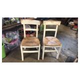 2 white  wicker seat chairs