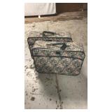 2 luggage on wheels flowers