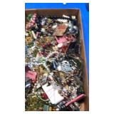 Flat of costume jewelry