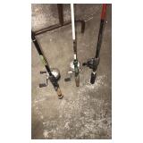 3 fishing poles with reels