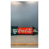 Sold here Coca Cola and a Coca Cola clock