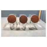 3 glass canisters 7" tall