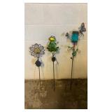 Yellow flower, frog on lily pad, butterfly on a