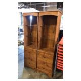 2 lighted cabinets glass shelves