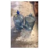 2 plastic water jugs
