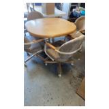 Table,4 upholstery chairs on wheels