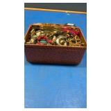 Tin box of jewelry