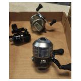 2 zebco and 1 daiwa reel