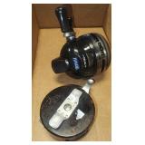 1 hawg reel and 1 automatic Shakespeare reel
