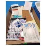 Postage stamps, advertising, and album full of