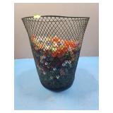 Wire test waste bin full of marbles