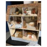 wooden doll house with bag of accessories