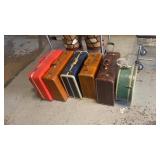 Seven pieces of vintage luggage