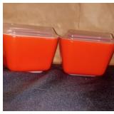 2 red pyrex glass dishes