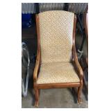 Wooden rocker chair with flowers