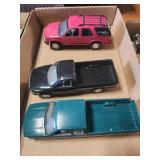 2 trucks and a Blazer