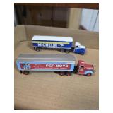 2 metal tire advertising semi truck and trailer