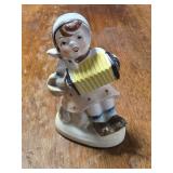 vintage ceramic figurine girl playing accordion