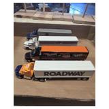 4 metal semi truck and trailers
