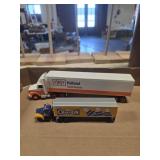 2 metal semi truck and trailers