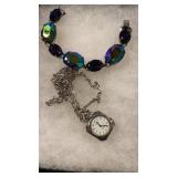 Watch necklace and iridescent bracelet