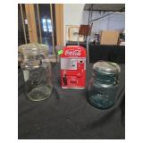 2 ball jars and a Coca-Cola tin advertising