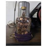 Crown Royal bottle full of pennies