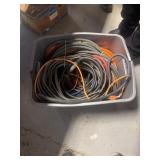 Tote with extension cords and hoses