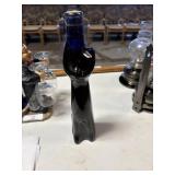 vintage cobalt blue glass bottle shaped like a