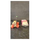 Tonka toy truck and fisher price wooden dog on