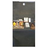 Surge protector,  lightbulb, wall hanging, book