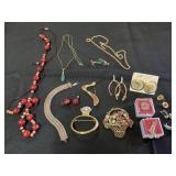 Gold toned necklaces , pins