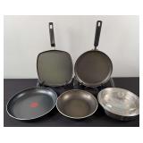 Stack of Assorted Skillets