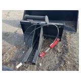 Skid loader tree puller attachment