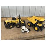 Toy tractor, dump truck and Winnebago truck