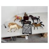 Toy horses and sign