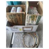 Cans of R12  refrigerant (23) and hose