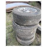 Stack of P225/60R15 tires on rims