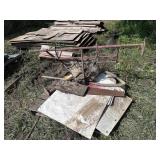 Pallet with hay hook, chains, saw, etc