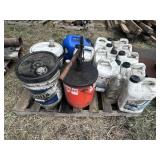 Pallet with used oil, kerosene can